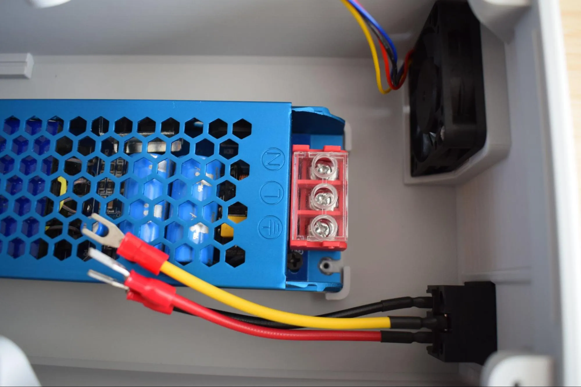 Lower PSU into housing