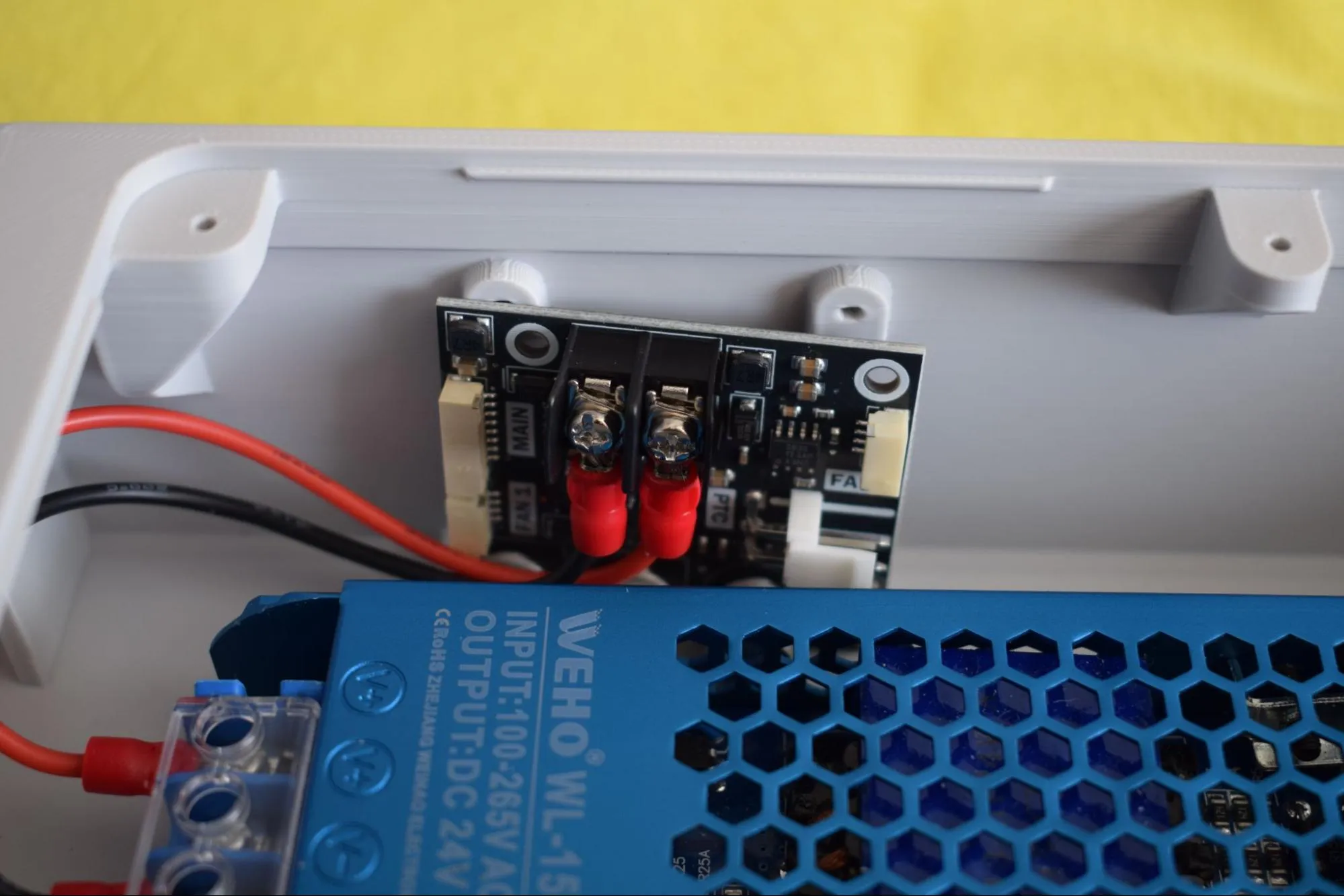Power board resting in housing